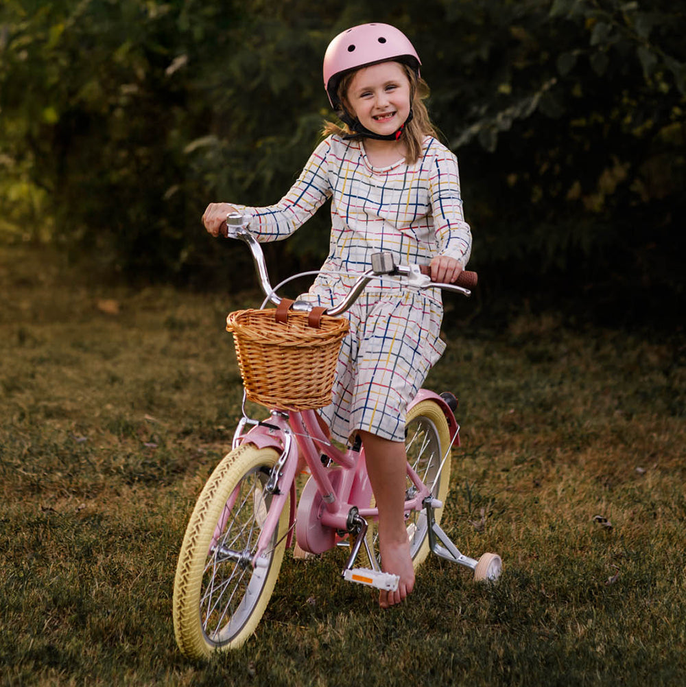 Child riding the Glerc Little Molly 20-inch bike outdoors